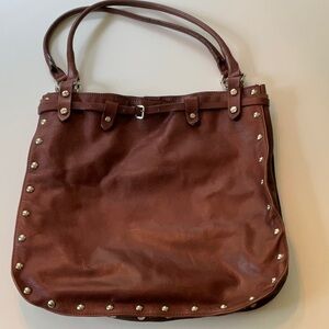 Maurizio Taiuti brown purse, silver colored studs and magnetic opener. Good cond